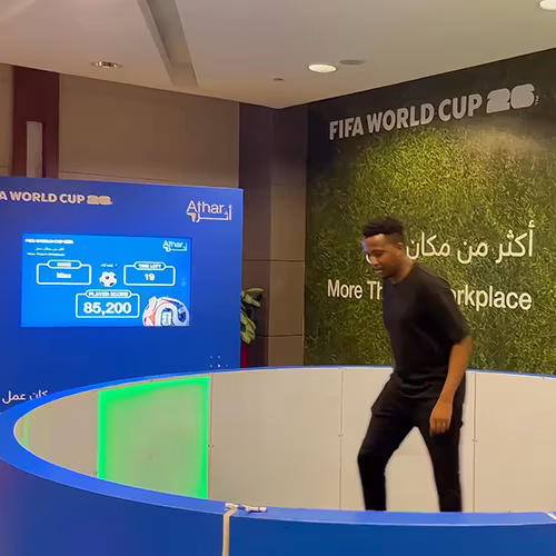 Custom-branded Interactive Football Arena setup at a Dubai exhibition venue with an electronic leaderboard for competition