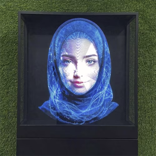 AI kiosk at an event features a digital display of a ai hologram woman in a blue hijab