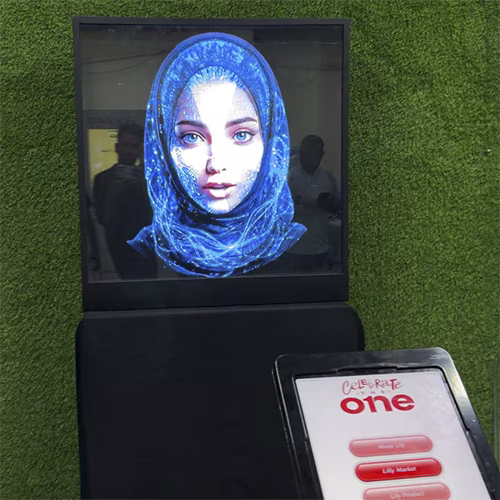 AI kiosk at an event features a digital display of a ai hologram woman in a blue hijab