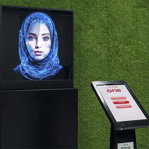 AI kiosk at an event features a digital display of a ai hologram woman in a blue hijab