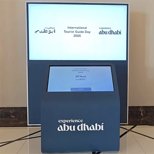 Multi-screen interactive UAE landmark guessing game display with custom branded interface for immersive event activation and digital tourism engagement.