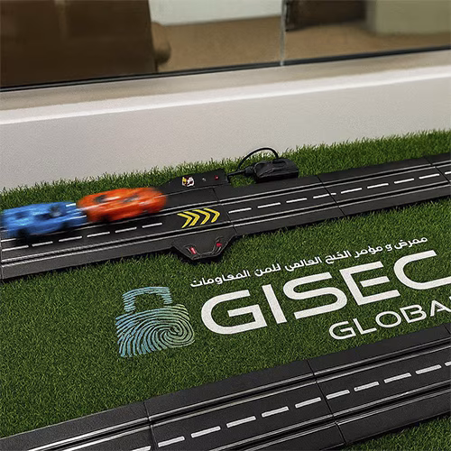 Guest wearing brainwave headband racing a slot car using mind control at a Dubai tech event. Interactive, hands-free game rental for events and exhibitions