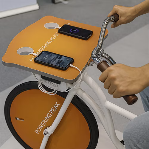 Guests competing to recharge their devices at a Recharge Station Challenge event, with branded stations and high-energy fun.