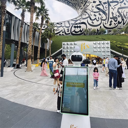 AI Robot Photo Booth at Dubai exhibition capturing branded, AI-enhanced photos for corporate event attendees in a vibrant, tech-driven setting