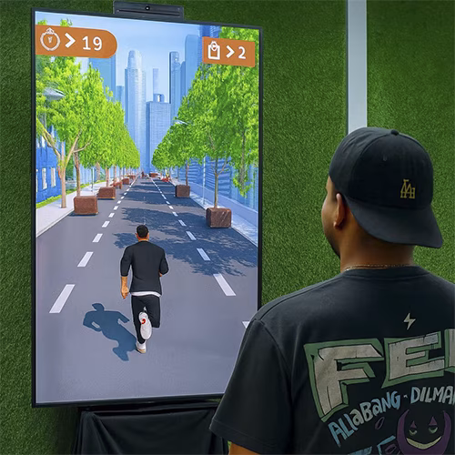 Player enjoying a motion runner game in Dubai, using full-body movement to jump and dodge obstacles. Interactive game rental