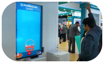 Player using body to slash branded items in a motion sensor game at exhibition in Dubai