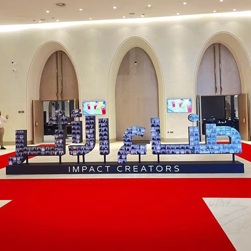 3D selfie sculpture mosaic display at a corporate event in Dubai with guest photos forming a 360-degree interactive art installation
