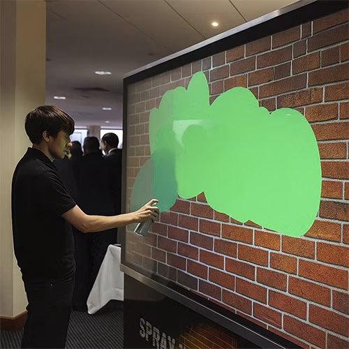 AI graffiti wall, digital graffiti, event rental Dubai, interactive wall, virtual spray paint, corporate events, brand activations, digital art
