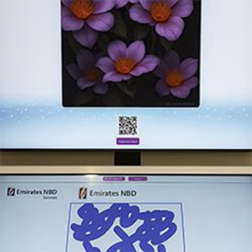 Guest using interactive screen for real-time AI painting at Dubai event, creating digital artwork with immersive technology experience by Mirror Booth Dubai