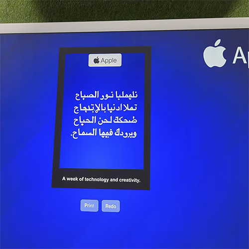 Young Emirati guest using AI Poem Generator kiosk in Dubai, creating personalized Arabic or English poem with instant printout and event branding