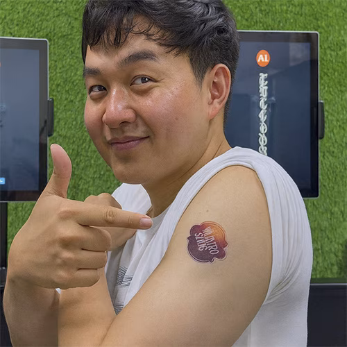 Guests creating their own AI Tattoos at exhibition in Dubai