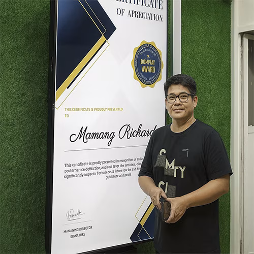 Calligraphy-style certificate printing setup at Dubai event