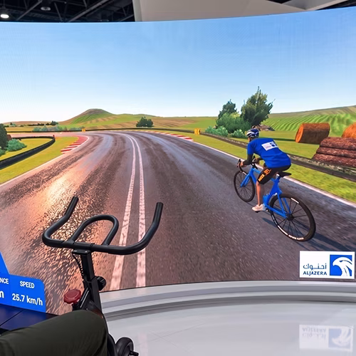 Interactive cycle simulator rental for corporate events and trade shows in Dubai by Mirror Booth Dubai