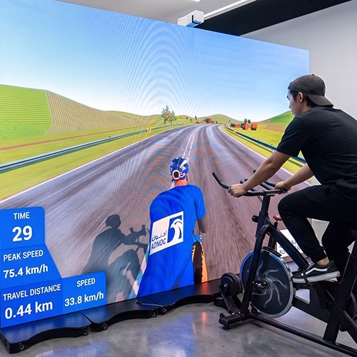 Interactive cycle simulator rental for corporate events and trade shows in Dubai by Mirror Booth Dubai
