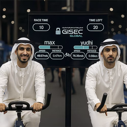 Guests racing on interactive bike game at corporate event in Dubai