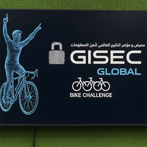 Guests racing on interactive bike game at corporate event in Dubai