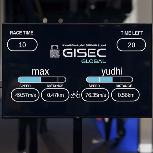 Guests racing on interactive bike game at corporate event in Dubai