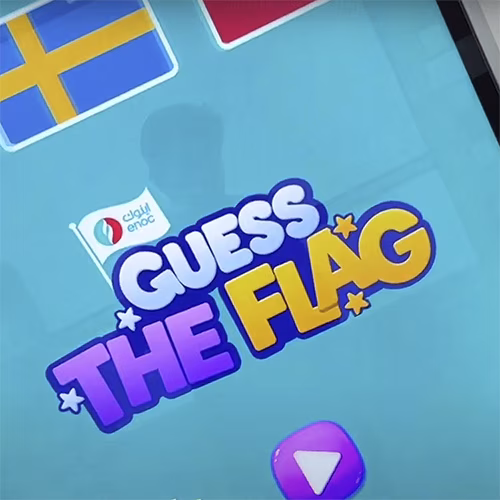 Participants playing the interactive Guess the Flag game at an event, engaging with a fun, branded quiz experience that tests geographical knowledge in a lively setting.