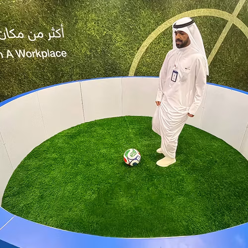 Custom-branded Interactive Football Arena setup at a Dubai exhibition venue with an electronic leaderboard for competition