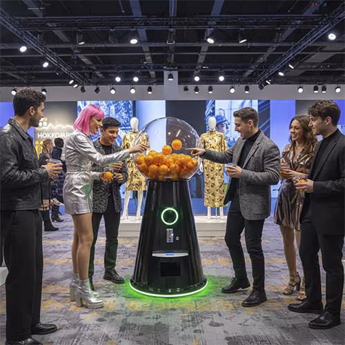 Interactive Gumball Machine at a Dubai brand activation event. Guests are playing and engaging with the sleek machine, creating memorable experiences.