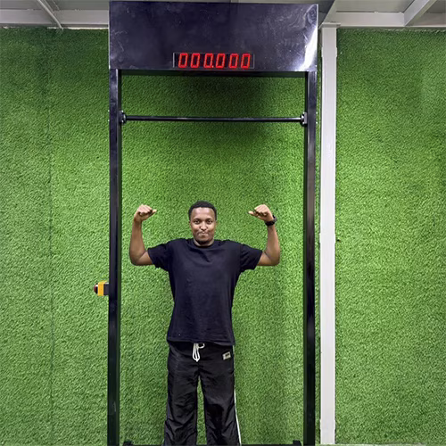 Viral 100-Second Hanging Challenge arcade machine rental for corporate events in Dubai, featuring a digital timer and participants testing their grip strength.