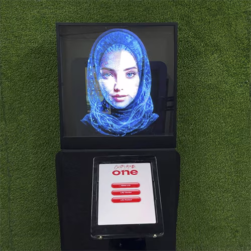 AI kiosk at an event features a digital display of a ai hologram woman in a blue hijab