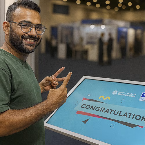 Guest solving a scrambled photo puzzle on a touchscreen at an event. Interactive image puzzle game rental for exhibitions, corporate events, and activations in Dubai.