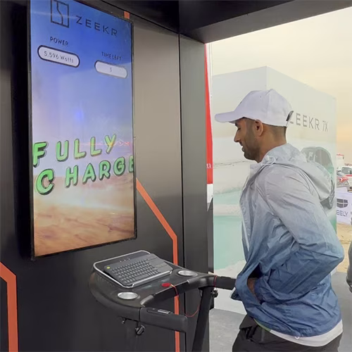 Interactive Treadmill Activation in Dubai: Participants generating human power to recharge EV cars