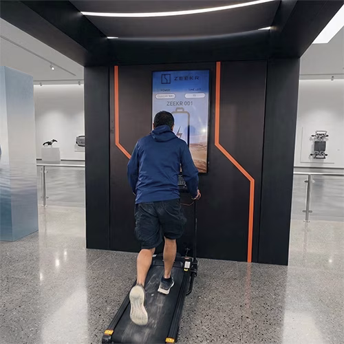 Interactive Treadmill Activation in Dubai: Participants generating human power to recharge EV cars