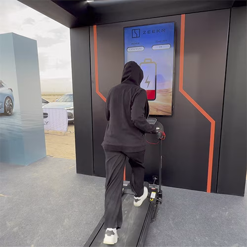 Interactive Treadmill Activation in Dubai: Participants generating human power to recharge EV cars