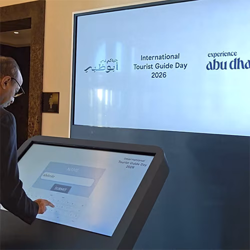 Multi-screen interactive UAE landmark guessing game display with custom branded interface for immersive event activation and digital tourism engagement.