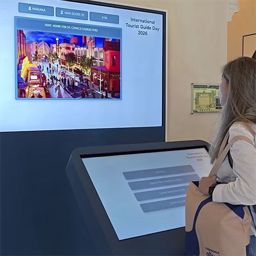 Multi-screen interactive UAE landmark guessing game display with custom branded interface for immersive event activation and digital tourism engagement.