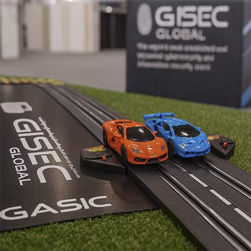 Guest wearing brainwave headband racing a slot car using mind control at a Dubai tech event. Interactive, hands-free game rental for events and exhibitions