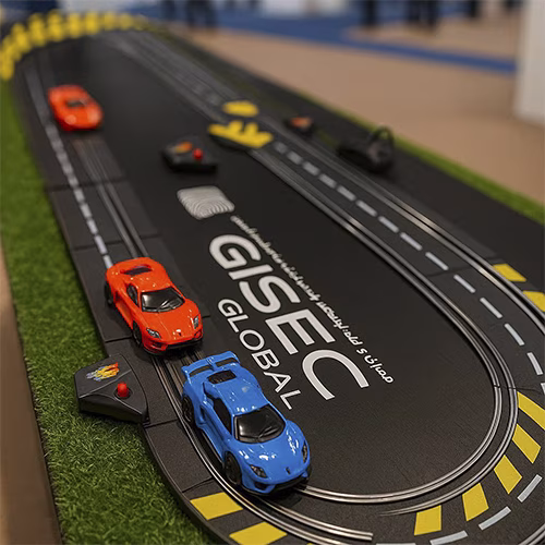 Guest wearing brainwave headband racing a slot car using mind control at a Dubai tech event. Interactive, hands-free game rental for events and exhibitions