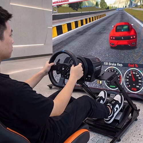 Woman using a pro-grade racing simulator setup with a high-precision wheel, pedals, black bucket seat, and large video screen showing a sports car track experience.