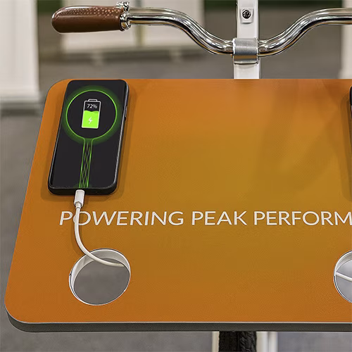 Guests competing to recharge their devices at a Recharge Station Challenge event, with branded stations and high-energy fun.
