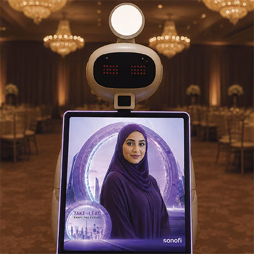 AI Robot Photo Booth at Dubai exhibition capturing branded, AI-enhanced photos for corporate event attendees in a vibrant, tech-driven setting