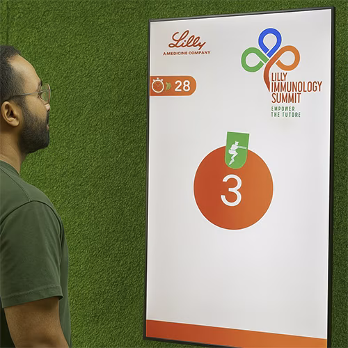Participants enjoying the Squat Game Challenge at a corporate event in Dubai, engaging in fitness and team-building through real-time interactive squat tracking.