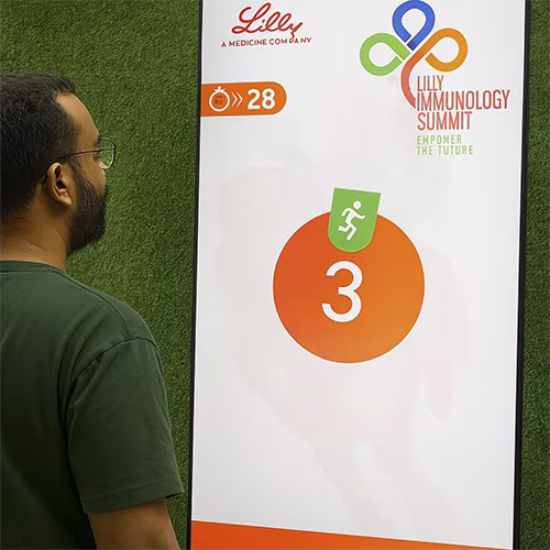 Participants enjoying the Squat Game Challenge at a corporate event in Dubai, engaging in fitness and team-building through real-time interactive squat tracking.